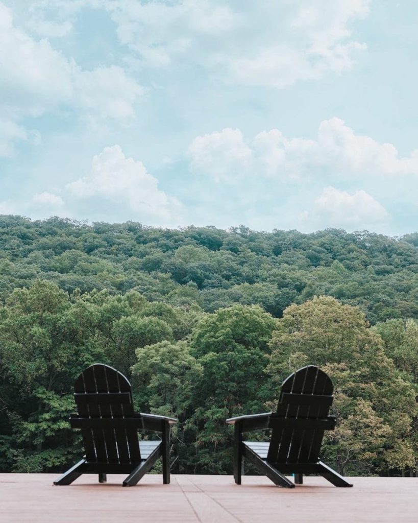 River mountain review, camping chairs facing the forest